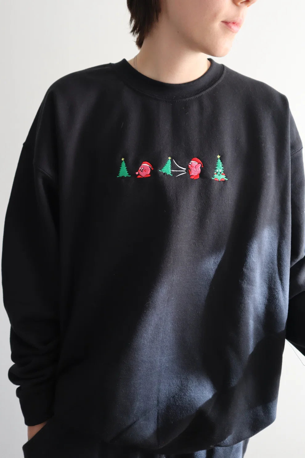 Embroidered Pink Guy Eating Christmas Tree Crewneck or Hoodie